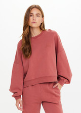 THE UPSIDE women's red organic cotton Serendipity Paloma Crew is designed for a boxy fit and features drop shoulders and The Upside logo puff printed at the front. Made for everyday.