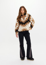 THE UPSIDE women's Harlow Fleece Pullover is a relaxed pullover style in our geometric star design and features a quarter zip opening, zip pockets and elasticated waist and cuffs to keep warmth in. Designed for Après-ski and winter wear.