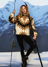 THE UPSIDE women's Harlow Fleece Pullover is a relaxed pullover style in our geometric star design and features a quarter zip opening, zip pockets and elasticated waist and cuffs to keep warmth in. Designed for Après-ski and winter wear.