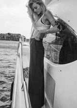 THE UPSIDE women’s navy Mira Wide Leg Pant is high-waisted made from quick-dry fabric, with a structured waistband and fly zip closure. Perfect for everyday.
