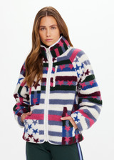 THE UPSIDE women’s Harlow Fleece Zip Through in multi star design features a relaxed fit, contrast woven binds, and a zip chest pocket. Made for everyday wear.
