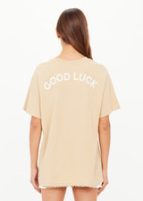 THE UPSIDE women's natural organic cotton Good Luck Sammi Tee is designed for an oversized fit and features "Good Luck" in cream printed on back. Made for versatile styling.