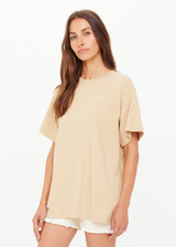 THE UPSIDE women's natural organic cotton Good Luck Sammi Tee is designed for an oversized fit and features "Good Luck" in cream printed on back. Made for versatile styling.
