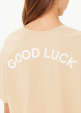 THE UPSIDE women's natural organic cotton Good Luck Sammi Tee is designed for an oversized fit and features "Good Luck" in cream printed on back. Made for versatile styling.