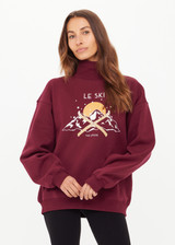 THE UPSIDE women's maroon organic cotton Le Ski Clementine Crew is designed for an oversized fit and features Le Ski logo print & embroidery on front chest. Designed for Après-ski and winter wear.