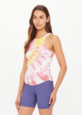 THE UPSIDE women's tie-dye organic cotton Asher Racerback Tank Top features hand tie-dyed tropical shades of pink, red, and yellow on a white base. Made for lifestyle.