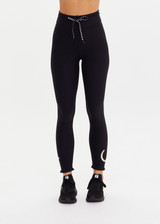 THE UPSIDE women's black recycled peached Celestia 25inch Legging is a soft & supportive fit and features a drawcord and printed star and horseshoe on ankles. Made for yoga & pilates.