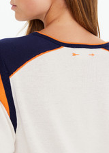 THE UPSIDE women's cream cotton Elixir Seven Tee is designed for a relaxed fit and features orange and navy stripes on neckline and shoulders. Made for everyday wear.