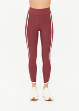 THE UPSIDE women's red recycled peached Samara 25inch Legging is a soft & supportive fit and features side pockets and contrast cream stripes with curved hem detail. Made for pilates.