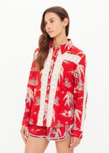 THE UPSIDE women's red Palma Bobbi Collared Shirt features sleeve plackets, pearlised buttons, and cream crochet lace panels. Perfect for travel or lifestyle.