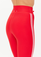 THE UPSIDE women's red eco tech Oxford 25-inch Legging is supportive and comfortable with cream side stripes and an elastic waist drawcord. Made for high impact.