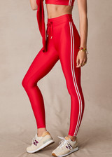 THE UPSIDE women's red eco tech Oxford 25-inch Legging is supportive and comfortable with cream side stripes and an elastic waist drawcord. Made for high impact.
