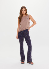 THE UPSIDE women's monogram jacquard Ezra Florence Flare is high-rise with a firm & supportive fit, featuring a V panel waistband and side seam split at hem. Made for yoga and pilates.