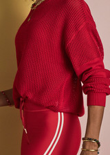 THE UPSIDE women's red organic cotton Fenway Sebastion Knit Crew has a relaxed fit with ribbed neckline and cuffs, and a logo knit detail on the back. Made for everyday wear.