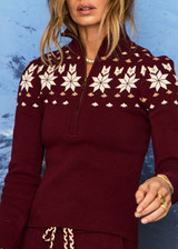 THE UPSIDE women’s maroon organic cotton Le Ski Blanche Half Zip features a zip through opening and a knitted snowflake design across chest and back. Designed for Après-ski and winter wear.