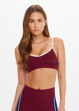 THE UPSIDE women’s maroon Adesa Scoop Danni Bra in recycled rib features scoop front and back necklines, removable cups, and soft elastic underbust. Made for high impact.