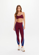 THE UPSIDE women’s maroon Adesa 25In High Midi Pant in recycled rib features a V-panel waistband and moisture-wicking properties. Made for high impact.