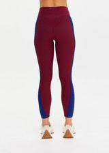 THE UPSIDE women’s maroon Adesa 25In High Midi Pant in recycled rib features a V-panel waistband and moisture-wicking properties. Made for high impact.