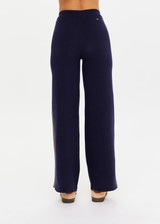 THE UPSIDE women's navy organic cotton Cosmo Freya Knit Pant is a true-to-size fit and features an elasticated waistband with beige knitted side stripes. Made for everyday wear.