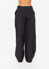 THE UPSIDE women's black recycled fabric Estelle Barrel Pant is designed for a boxy fit and features a structured waistband with belt loops and side seam pockets. Made for everyday.