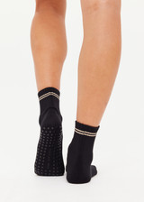 THE UPSIDE women's black Celestia Grip Sock is an anti slip grip sock perfect for pilates & yoga. Featuring a soft terry sole and embroidered lucky horseshoe & star.