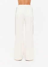 THE UPSIDE women's cream Roma Pant is a true-to-size fit and features an elasticated waistband with drawcord, pockets and black and cream contrast stripes down sides. Perfect for everyday.