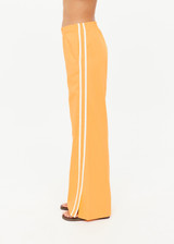 THE UPSIDE women’s lightweight yellow Juliet Pant features a low-rise fit with contrast binds and split hem detail. Perfect for travel and everyday wear.