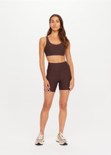 THE UPSIDE women's brown Peached Jade Racerback Bra offers a soft & supportive fit and features removable cups and moisture control properties. Made for yoga & pilates.