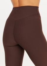 THE UPSIDE women's brown Peached Florence Flare is a high-rise full length flare pant with V waistband and a printed arrow logo on back waistband.