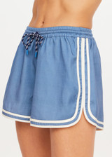 THE UPSIDE women's blue Klio Short is designed for a mid-rise, relaxed fit and features a soft elasticated waistband with drawcord and contrast binds in cream along curved hem. Made for everyday.