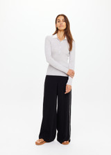 THE UPSIDE women's grey Faye Fine Knit Polo is slim fit in 100% merino wool with contrast cream accents and front button closure. Made for lifestyle.
