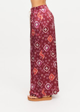 THE UPSIDE women's maroon Miri Kato silk wide-leg pant is designed for an oversized fit and features a gathered front waist with cream plaited drawcord. Made for lifestyle.