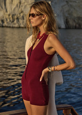 THE UPSIDE women's maroon organic cotton Simi Knitted Playsuit is fitted with a low V-neck and button-up closure with antique brass buttons. Made for lifestyle.
