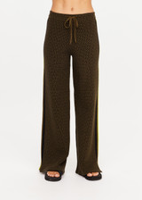 THE UPSIDE women's olive organic cotton Castilla Juniper Knit Pant has a soft and supportive fit and features a straight leg with contrast side stripes. Made for lifestyle.