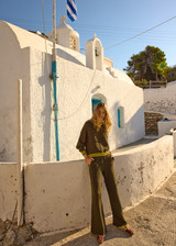 THE UPSIDE women's olive organic cotton Castilla Juniper Knit Pant has a soft and supportive fit and features a straight leg with contrast side stripes. Made for lifestyle.