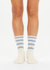 THE UPSIDE women's cream Isadora Crew Sock features jacquard stripes in lime and blue. Made for everyday.