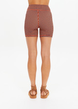 THE UPSIDE women's orange & navy check Solaris 5inch Spin Short is mid-rise and features an embroidered arrow logo at back. Made for yoga & pilates.