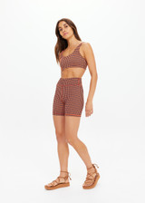 THE UPSIDE women's orange & navy check Solaris 5inch Spin Short is mid-rise and features an embroidered arrow logo at back. Made for yoga & pilates.