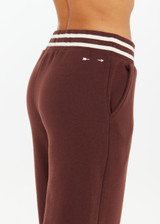 THE UPSIDE women's brown organic cotton Toluca Willow Wide Leg Pant is high-waisted and features a cream striped ribbed waistband and side seam pockets. Made for everyday.