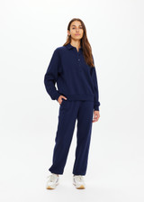 THE UPSIDE women's navy organic cotton Collared Elle Polo is a relaxed long sleeve polo featuring buttons on front. Made for everyday.