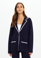 THE UPSIDE women's navy Monte Carlo Alix Knit Blazer fits true-to-size and features contrast white edge along collar and placket and patch pockets at front. Made for lifestyle.