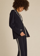 THE UPSIDE women's navy Monte Carlo Alix Knit Blazer fits true-to-size and features contrast white edge along collar and placket and patch pockets at front. Made for lifestyle.