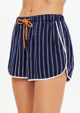 THE UPSIDE women's navy & white stripe Belize Marlin Short is a low-rise mini short, featuring a elasticated waistband with drawcord, side seam pockets in linen fabrication. Made for lifestyle.