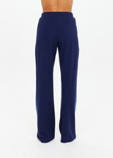 THE UPSIDE women's navy Lenzing viscose Petra Flare is designed for a true-to-size fit and features flare pants with splits and contrast chevron tape down side seams. Made for lifestyle.
