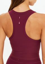 THE UPSIDE women's maroon recycled peached Sophie Crop Top is designed for a soft and supportive fit and features a racerback longline bra with internal shelf bra. Made for yoga and pilates.