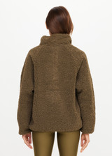 THE UPSIDE women's green recycled polyester Harlow Fleece Pullover is designed for a relaxed fit and features a quarter snap button opening and zip pockets. Made for lifestyle.