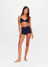 THE UPSIDE women's navy Palais Rib Capri Bra is designed to be worn under sheer garments and features a v neckline with adjustable straps in a soft ribbed fabrication. Made for lifestyle.