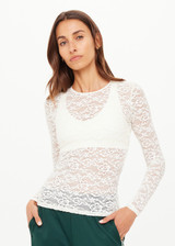 THE UPSIDE women's cream Lyon Rosa Long Sleeve Top is a fitted, sheer lace style with a crew neckline. Made for everyday wear and layering.