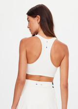 THE UPSIDE women's cream recycled soft peached Courtship Jetta Racerback Bra features a V neckline with removable cups and an elasticated underbust for support. Made for tennis, golf & pickleball.