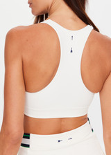 THE UPSIDE women's cream recycled soft peached Courtship Jetta Racerback Bra features a V neckline with removable cups and an elasticated underbust for support. Made for tennis, golf & pickleball.